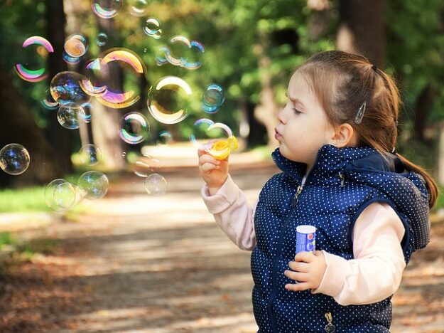 kid with baloon